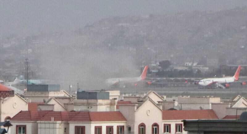 Smoke billows near Hamid Karzai International Airport after a suicide attack in Kabul on August 26, 2021. EPA