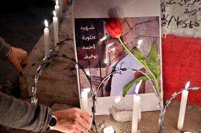 Anti-government protesters light candles after protester Ahmad Tawfik died, in Martyrs' Square, Beirut, Lebanon. Lebanese anti-government protestor Ahmad Tawfik succumbs to his wounds on 17 February following three months of surgeries and medical treatment. He was shot in the stomach at a protest in October 2019 in Tripoli north Lebanon.  EPA