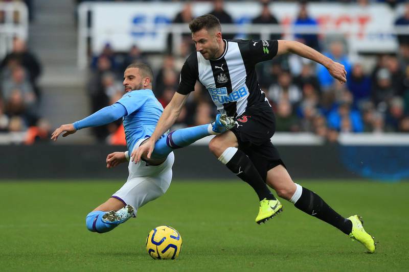 Manchester City's English defender Kyle Walker (L) vies with Newcastle United's Welsh defender Paul Dummett during the English Premier League football match between Newcastle United and Manchester City at St James' Park in Newcastle-upon-Tyne, north east England on November 30, 2019. (Photo by Lindsey Parnaby / AFP) / RESTRICTED TO EDITORIAL USE. No use with unauthorized audio, video, data, fixture lists, club/league logos or 'live' services. Online in-match use limited to 120 images. An additional 40 images may be used in extra time. No video emulation. Social media in-match use limited to 120 images. An additional 40 images may be used in extra time. No use in betting publications, games or single club/league/player publications. / 