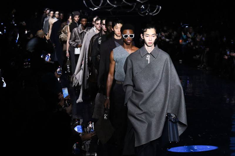 Long coats incorporated a wraparound asymmetrical cape for Fendi's autumn/winter 2023-2024 men's collection. AFP