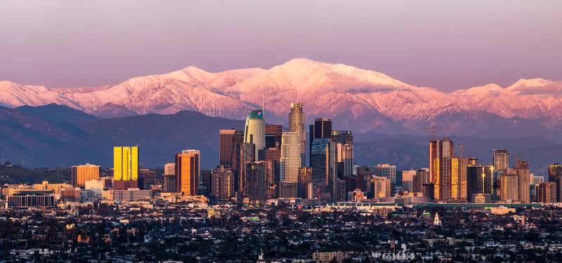 The Los Angeles skyline framed by the San Bernardino Mountains and Mount Baldy. Getty