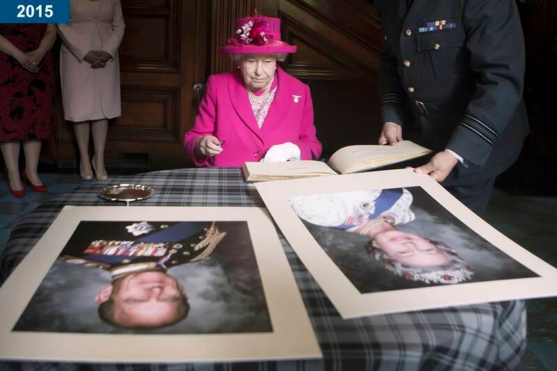 2015: The queen signs a book during a visit to the headquarters of the Royal Auxiliary Air Force's 603 Squadron in Edinburgh, Scotland.