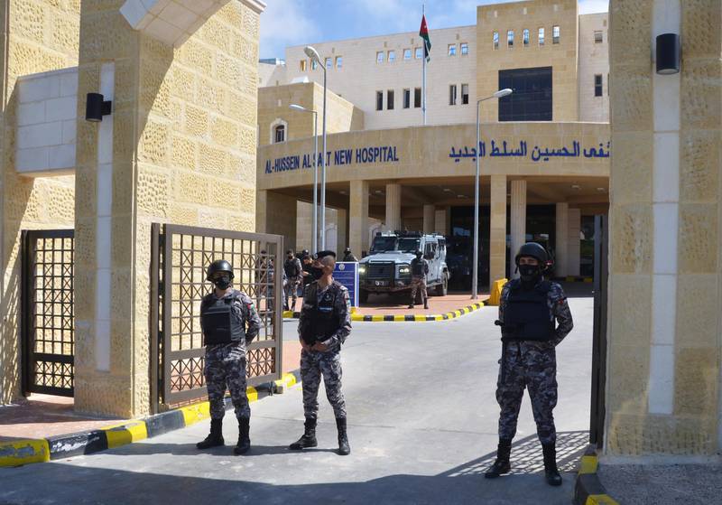 Gendarmerie officers guard the gate of the government hospital in the city of Al Salt, Jordan. Reuters