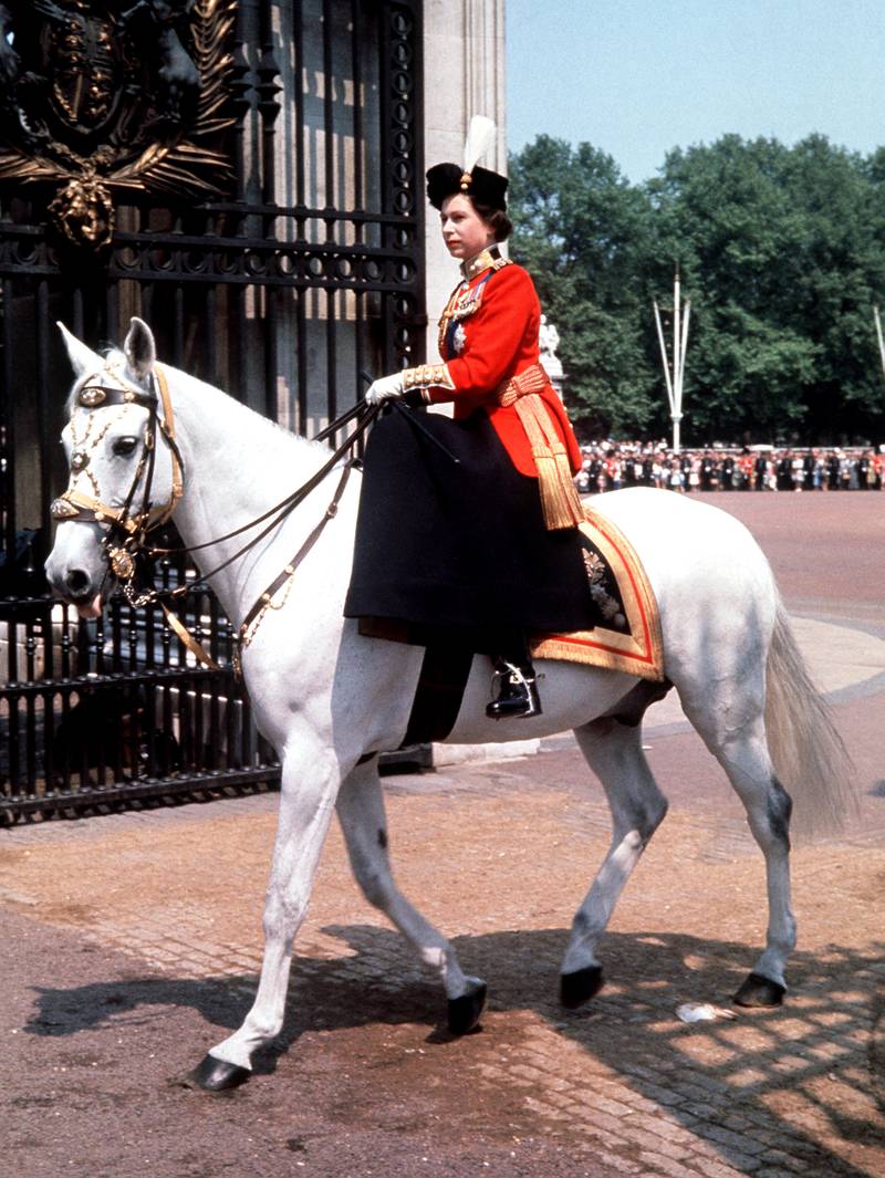 Queen Elizabeth riding side-saddle as she returns to Buckingham Palace, London, after attending the Trooping the Colour ceremony on Horse Guards Parade in June 1993. PA 