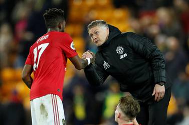 Ole Gunnar Solskjaer, right, believes Fred is showing plenty of improvement after a tough start to his Manchester United career. Reuters