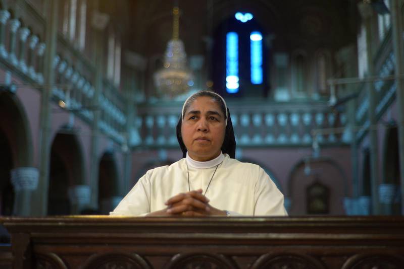 At the Sacred Heart Cathedral in Lahore, a Catholic nun named Sister Angelina kneels down in prayer. Mobeen Ansari 