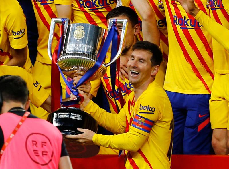 Barcelona's Lionel Messi lifts the trophy with celebrating teammates after winning the Copa Del Rey final against Athletic Bilbao. Getty