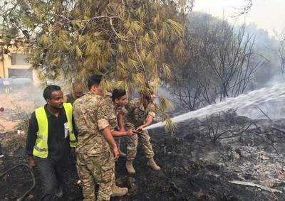 Lebanese army personnel tackle the forest fire. Image @LebarmyOfficial via Twitter