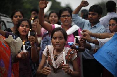 Protesters hold candles and march outside a court in Delhi mark the verdict in the rape and murder of a student last year.

AP Photo
