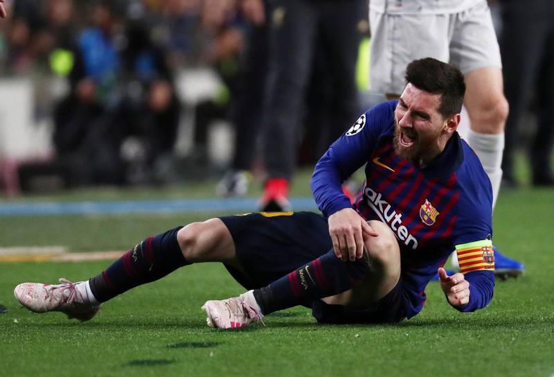 Barcelona's Lionel Messi on the floor after being fouled. Reuters