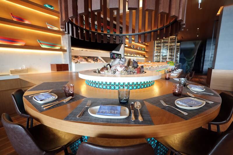The dining area and food display counter at La Mar. Chris Whiteoak / The National