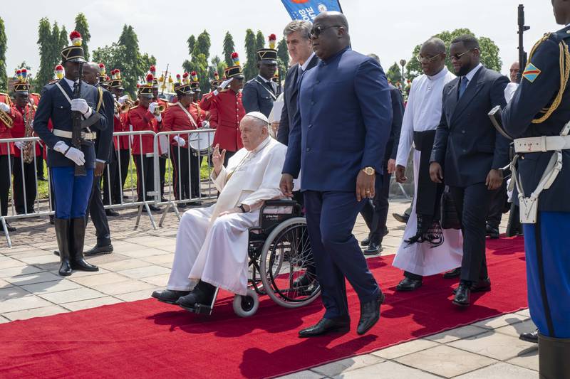 Pope Francis waves as he departs for South Sudan from Kinshasa.  AP Photo