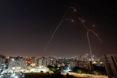 Israel's Iron Dome anti-missile system fires interception missiles as rockets are launched from Gaza towards Israel on Wednesday. Reuters