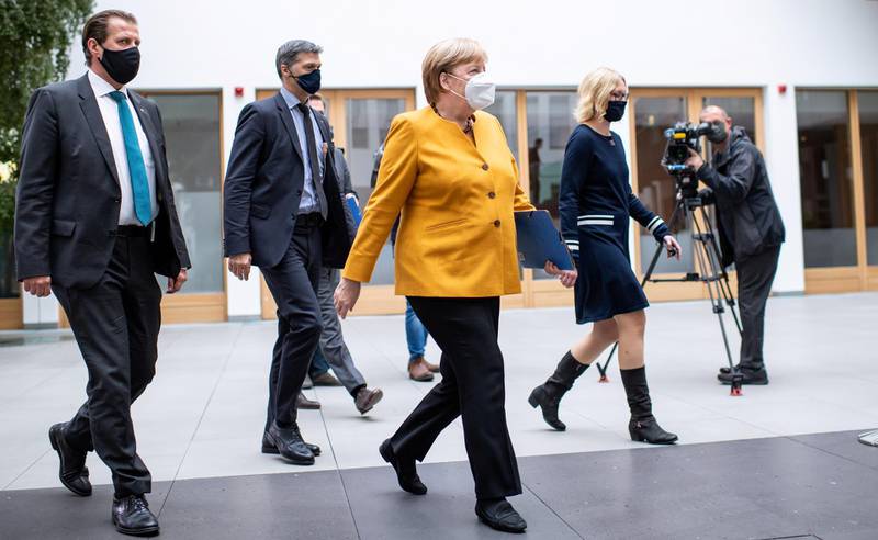 German Chancellor Angela Merkel arrives for a news conference in Berlin after discussing with her cabinet new measures to contain the spread of the coronavirus disease. Reuters