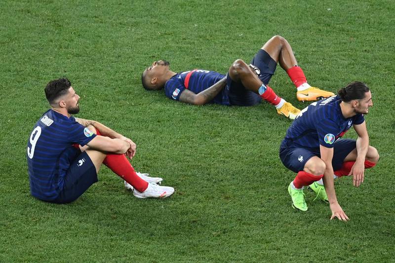 France's players react to their defeat. AFP