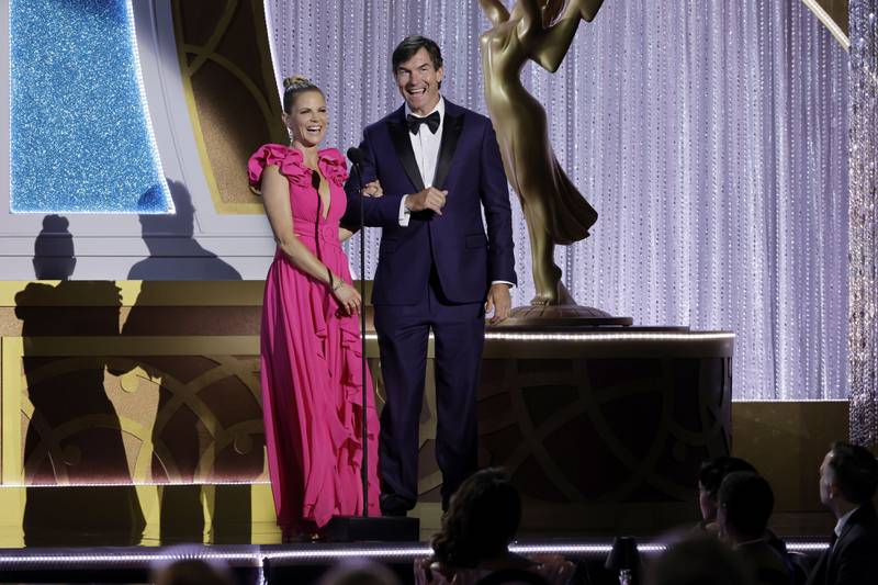 Natalie Morales and Jerry O'Connell speak on stage. AFP