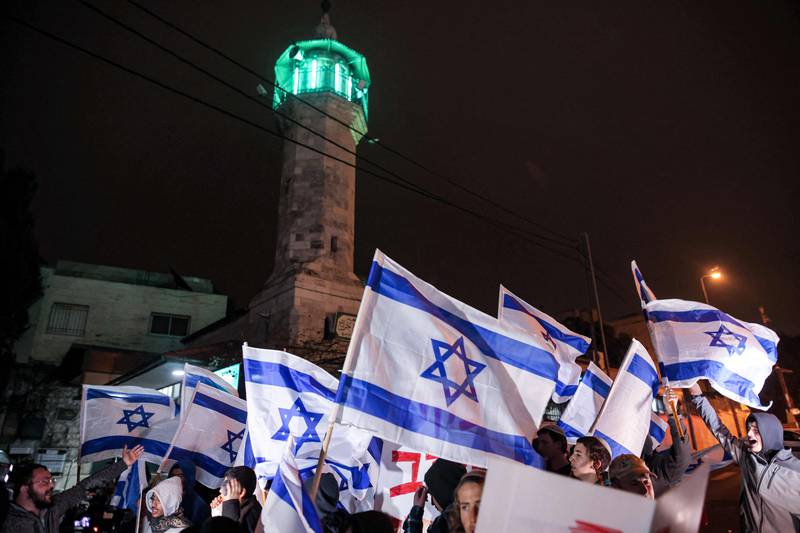 Israeli far-right demonstrators gather on December 8 after a stabbing attack in Sheikh Jarrah, in occupied East Jerusalem. AFP