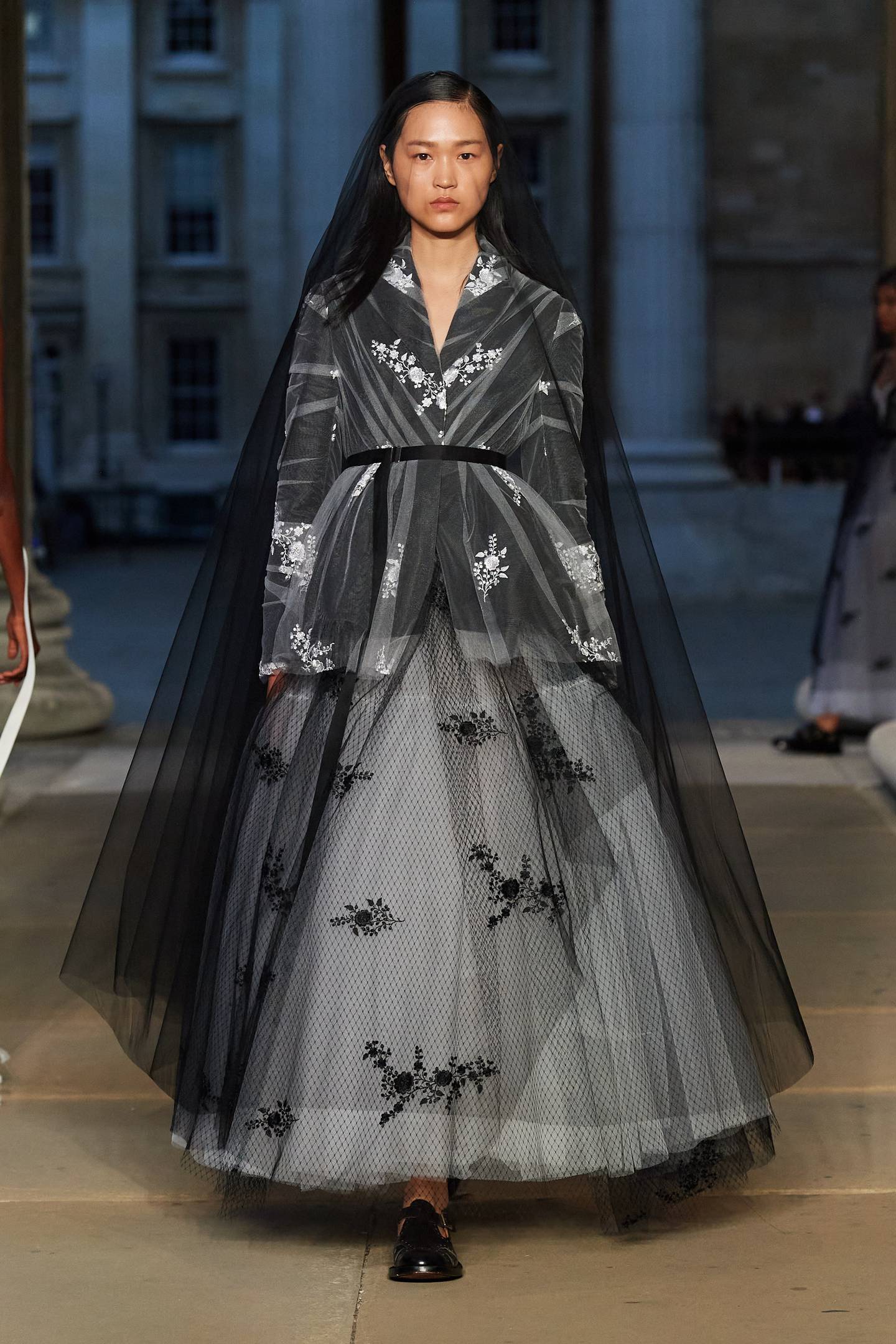 A full skirt look with embroidery and a veil at Erdem.  Photo: Erdem