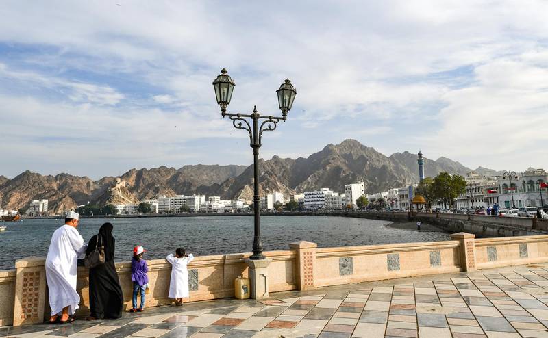 An Omani family stands by the waterfront in the Mutrah area of the capital Muscat on November 16, 2018. (Photo by GIUSEPPE CACACE / AFP)