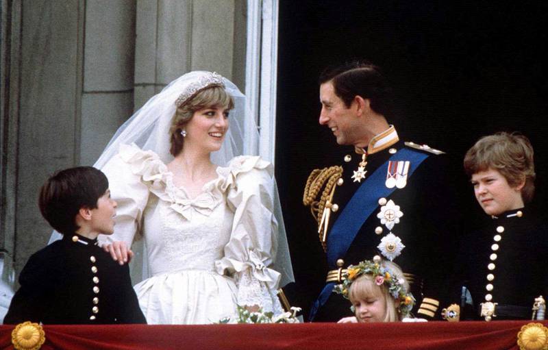 Prince Charles and Princess Diana, wearing a gown by Elizabeth and David Emanuel, stand on the balcony of Buckingham Palace in London, England, following their wedding at St Paul's Cathedral on June 29, 1981. Reuters