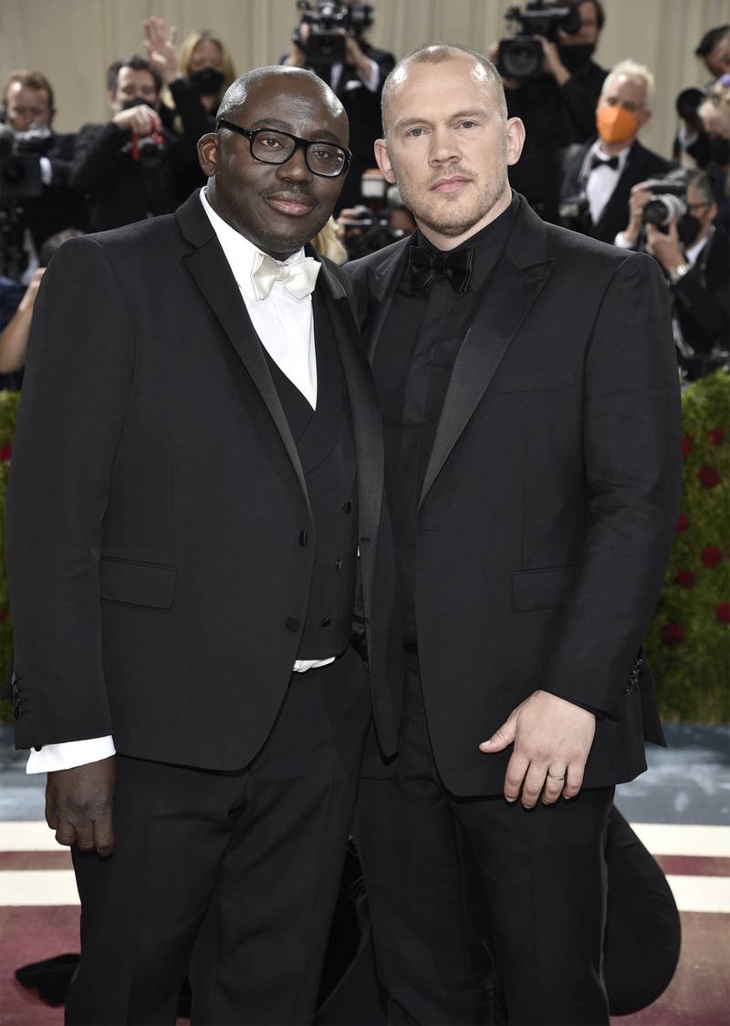 Edward Enninful, in white tie, and Alec Maxwell, in black tie, in tuxedos by Burberry. AP Photo