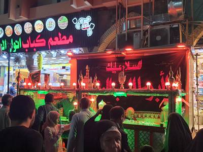 A stall offers free tea and water for pilgrims outside the shrines of Imam Hussein and his brother Imam Abbas. Sinan Mahmoud / The National