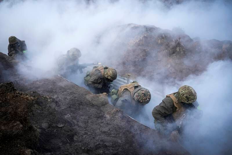 Smoke grenades and blank rounds were part of the trench warfare exercise in Britain. Getty 