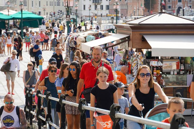 Tourists near San Marco square in Venice, Italy, where six million foreign tourists took a holiday this summer. Bloomberg