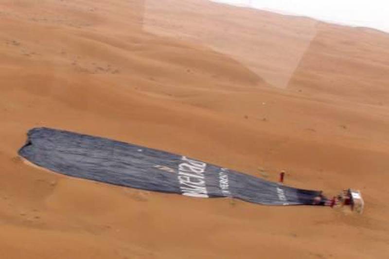                                Two people died and one person was seriously injured when this hot air balloon made a crash landing in the desert outside Al Ain during an early morning flight Sunday, April 25th, 2010. Photo Courtesy Abu Dhabi Police Department *** Local Caption ***  491c9273-8329-44a2-a71c-5e4fbf91d6ea.jpg