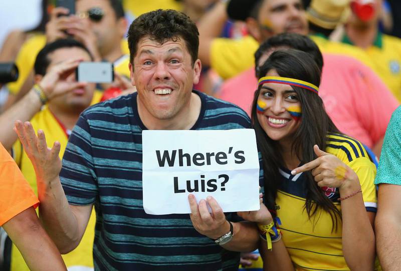 Colombian fans hold up a sign 'Where's Luis' in reference to the banned Luis Suarez ahead of their team's match against Uruguay on Saturday at the 2014 World Cup. Jamie Squire / Getty Images