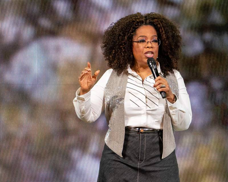 Oprah Winfrey wears a denim skirt with a white shirt and waistcoat to speak on stage during Oprah's 2020 Vision: Your Life in Focus Tour in Dallas, Texas on February 15, 2020. AFP