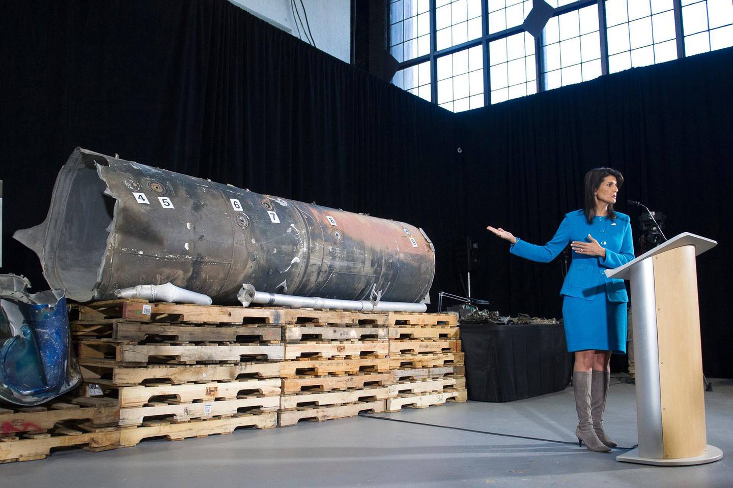 U.S. Ambassador to the U.N. Nikki Haley gestures as she speaks in front recovered segments of an Iranian rocket during a press briefing at Joint Base Anacostia-Bolling, Thursday, Dec. 14, 2017, in Washington. Haley says "undeniable" evidence proves Iran is violating international law by funneling missiles to Houthi rebels in Yemen. Haley unveiled recently declassified evidence including segments of missiles launched at Saudi Arabia from Houthi-controlled territory in Yemen. (AP Photo/Cliff Owen)