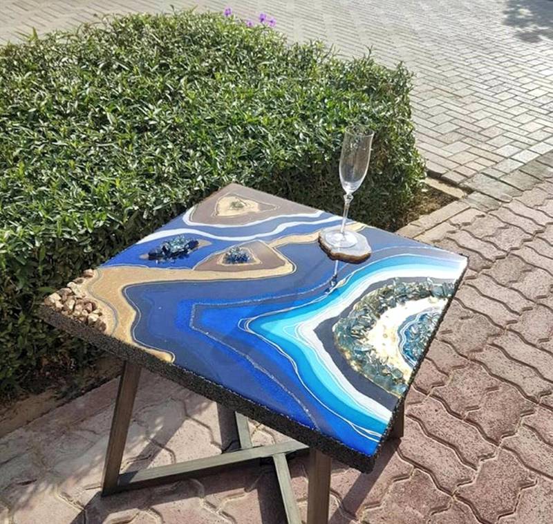 Transform a table into a talking piece with resin art. Courtesy Dina Khataan
