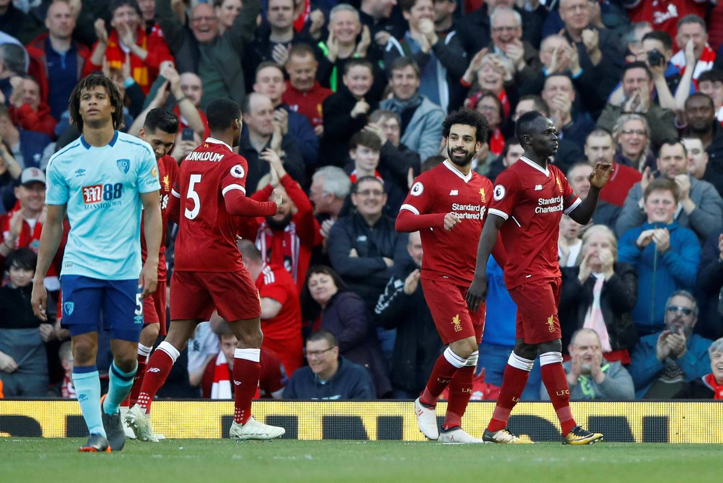 Soccer Football - Premier League - Liverpool vs AFC Bournemouth - Anfield, Liverpool, Britain - April 14, 2018   Liverpool's Mohamed Salah celebrates scoring their second goal with team mates      Action Images via Reuters/Carl Recine    EDITORIAL USE ONLY. No use with unauthorized audio, video, data, fixture lists, club/league logos or "live" services. Online in-match use limited to 75 images, no video emulation. No use in betting, games or single club/league/player publications.  Please contact your account representative for further details.