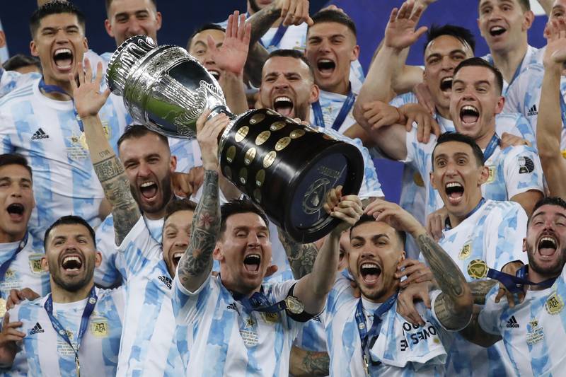 Argentina's Lionel Messi celebrates with the trophy after beating Brazil 1-0 in the 2021 Copa America final at the Maracana in Rio de Janeiro. AP