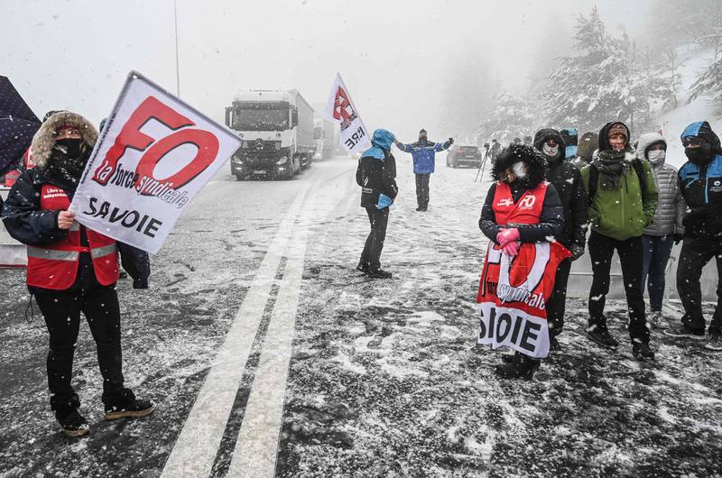 Ski resort workers protest on the road near the border with Italy. AFP