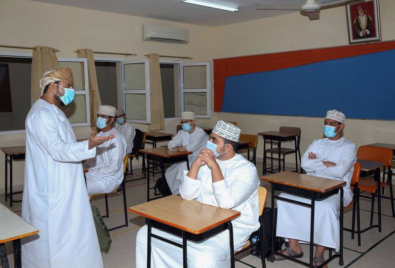 Omani students wearing protective masks amid the Covid-19 pandemic in Muscat, Oman. AFP