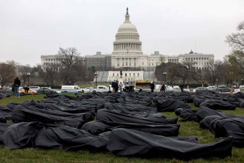Body bags are assembled on the National Mall by gun control activist group March For Our Lives on March 2022 in Washington. AFP