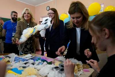 The VIP visitors helped children make tissue-paper bears to give as Mother's Day gifts. AP 