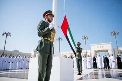 Military personnel prepare to raise the national flag at Qasr Al Watan. Photo: WAM