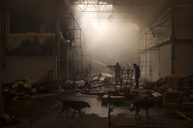 A market on fire in Kharkiv after a Russian attack. AP