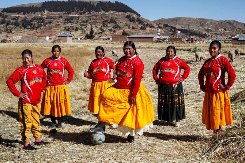 A football team of Aymara indigenous women pose for a picture before a championship in Puno, southern Peru. AFP