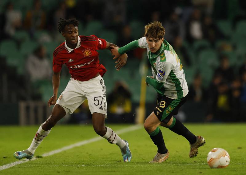 Manchester United's Noam Emeran in action with Real Betis' Juan Miranda during a friendly match at Estadio Benito Villamarin in Seville, Spain on December 10, 2022. Reuters