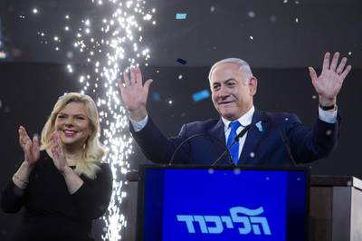 Benjamin Netanyahu and his wife Sara greet supporters in Tel Aviv. Getty Images