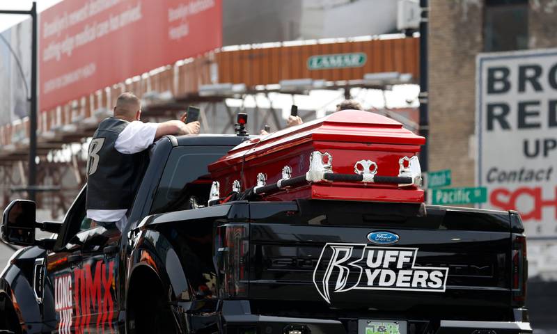 The casket of US rapper DMX is seen on a monster truck on Flatbush avenue outside the Barclays Centre. EPA