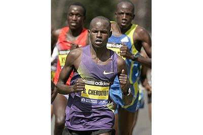 Robert Cheruiyot won the Boston Marathon, ahead of Deroba Merga, left,  in record time.