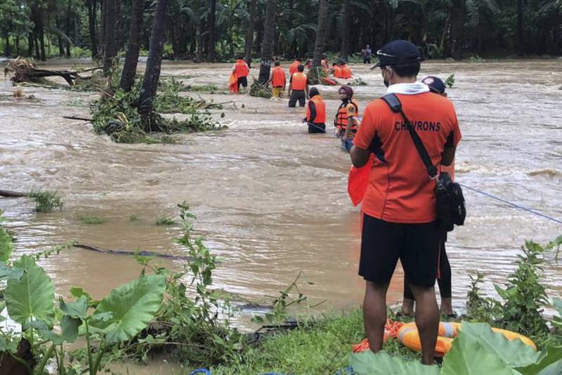 Landslides and flash floods were set off by the storm, which tore through the tip of the northern Philippines overnight on Monday then blew away on Tuesday, officials said. Photo: AP