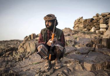 A member of Yemeni resistance forces of Abu Jabr brigade is seen near a front line position in Zi Naem town of Al-Bayda governorate. Asmaa Waguih for The National