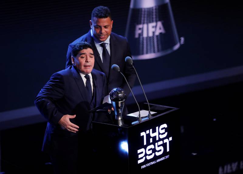 Former Argentina player Diego Maradona and former Brazil player Ronaldo speak during the awards. Eddie Keogh / Reuters