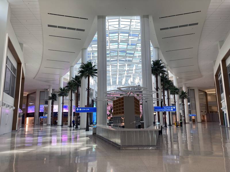Artificial palm trees line at Orlando International Airport. AP 